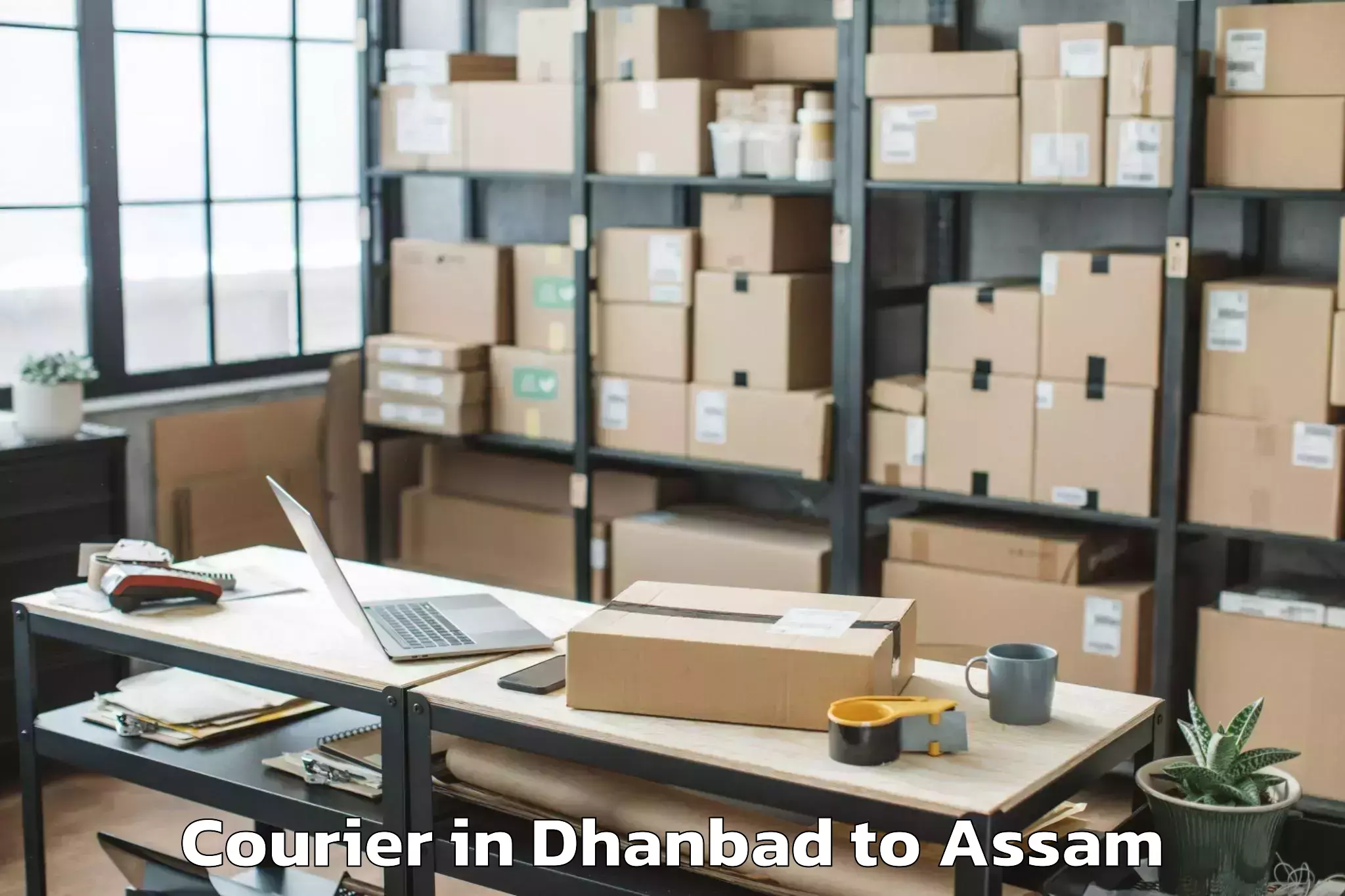 Top Dhanbad to Lumding Rly Colony Courier Available